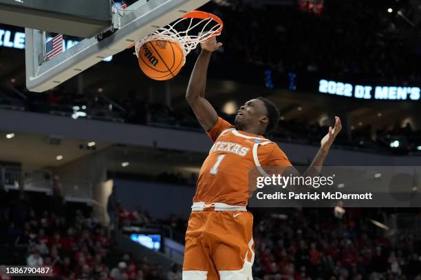 Andrew Jones of the Texas Longhorns dunks the ball during the first half against the Purdue Boilermakers in the second round of the 2022 NCAA Men's...