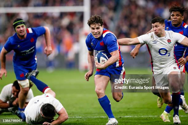 Antoine Dupont of France breaks away to score his sides try during the Guinness Six Nations Rugby match between France and England at Stade de France...