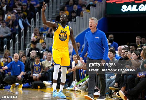 Draymond Green and head coach Steve Kerr of the Golden State Warriors reacts when Green was ejected from the game after receiving his second...