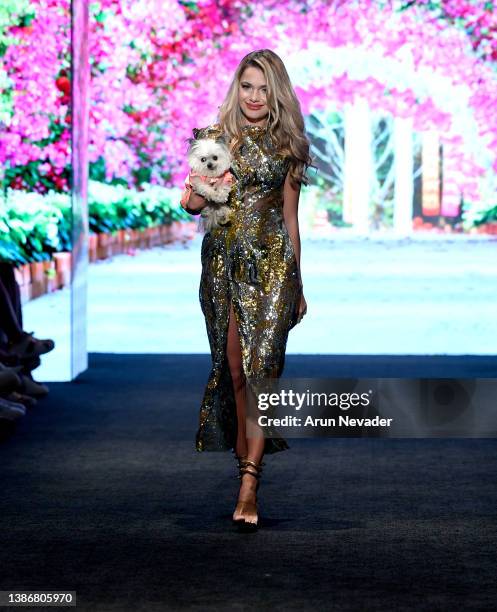 Anna Mudrik and dog walk the runway wearing Anthony Rubio at Los Angeles Fashion Week Powered By Art Hearts Fashion Fall/Winter 2022 on March 20,...