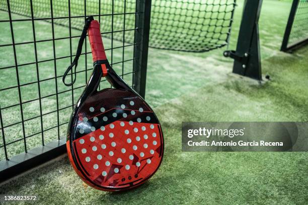 paddle tennis racket in court. padel tournament - using a paddle imagens e fotografias de stock