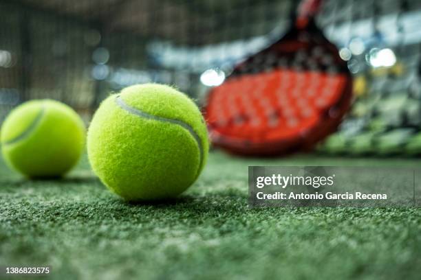 paddle tennis racket in court. padel tournament, focus on ball - tennis ball imagens e fotografias de stock