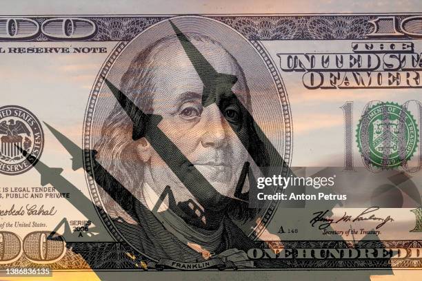 missiles on the background of 100 dollar bill. economic crisis due to war - weapon stock pictures, royalty-free photos & images