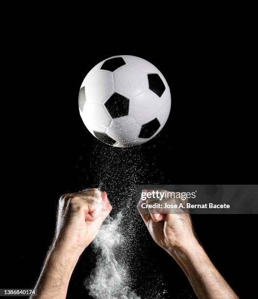 hand of a soccer goalkeeper catching a ball. - ballon rebond stock-fotos und bilder
