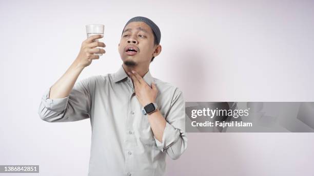very thirsty when fasting on ramadan - fasting activity stock pictures, royalty-free photos & images