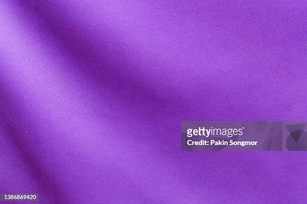 fabric for sports clothing in a purple color, the texture of a football shirt jersey, and a textile background - football background foto e immagini stock