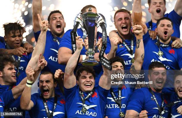 Antoine Dupont of France lifts the Six Nations Trophy with teammates after victory in the Guinness Six Nations Rugby match between France and England...