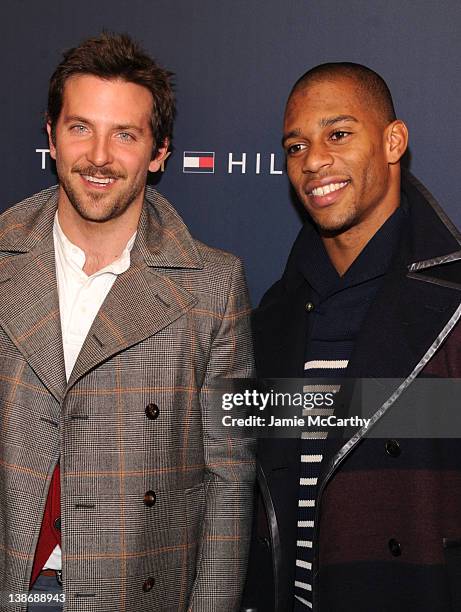 Actor Bradley Cooper and New York Giants wide receiver Victor Cruz pose backstage at the Tommy Hilfiger Presents Fall 2012 Men's Collection show...