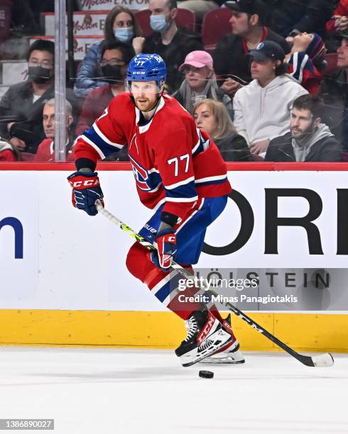 Brett Kulak of the Montreal Canadiens skates the puck against the Ottawa Senators during the third period at Centre Bell on March 19, 2022 in...