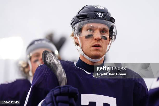 Rasmus Sandin of the Toronto Maple Leafs walks off of the field against the Buffalo Sabres at the 2022 Tim Hortons NHL Heritage Classic at Tim...