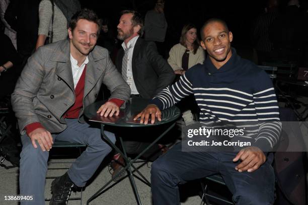 Actor Bradley Cooper and New York Giants wide receiver Victor Cruz attend the Tommy Hilfiger Men's Fall 2012 fashion show during Mercedes-Benz...