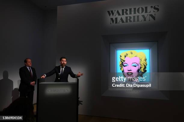Christie’s Americas chairman Marc Porter looks on as Christie's chairman, 20th and 21st Century Art, Alex Rotter announces that Christie's will offer...