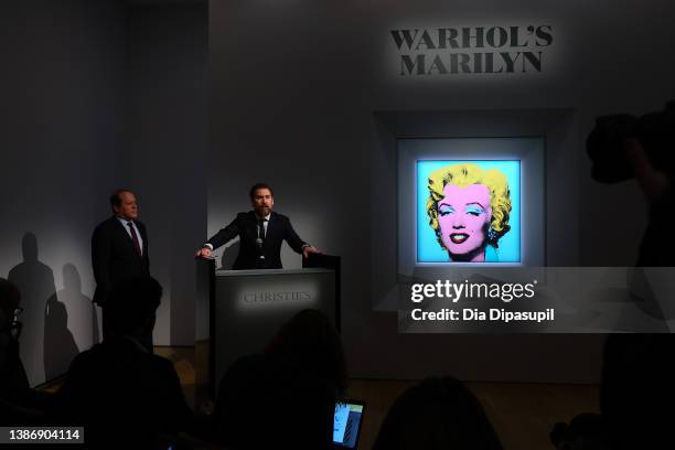 Christie’s Americas chairman Marc Porter looks on as Christie's chairman, 20th and 21st Century Art, Alex Rotter announces that Christie's will offer...