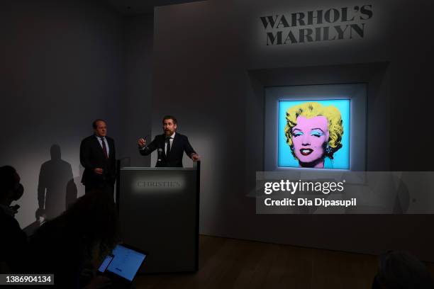 Christie’s Americas chairman Marc Porter looks on as Christie's chairman, 20th and 21st Century Art, Alex Rotter announces that Christie's will offer...