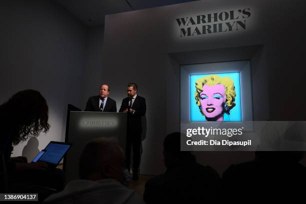 Christie’s Americas chairman Marc Porter looks on as Christie's chairman, 20th and 21st Century Art, Alex Rotter announces that Christie's will offer...