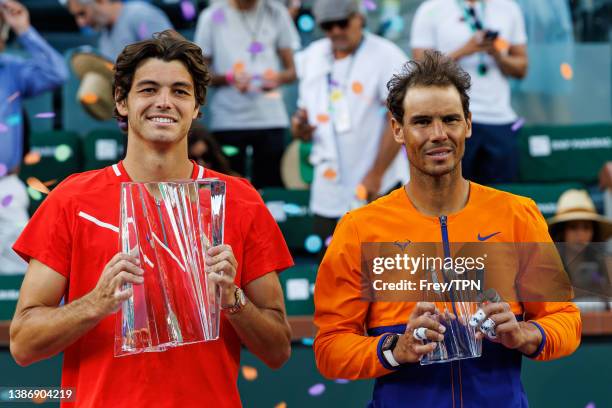 Taylor Fritz of the United States and Rafael Nadal of Spain pose with their trophies after the men's final of the BNP Paribas Open on March 20, 2022...