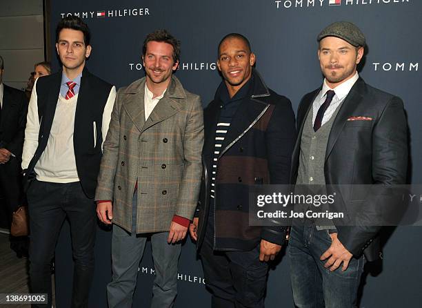 Singer Gabe Saporta, actor Bradley Cooper, New York Giants wide receiver Victor Cruz, and actor Kellan Lutz pose backstage at the Tommy Hilfiger...