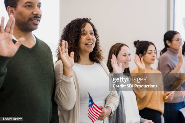 classmates focus on their professor - immigration ceremony stock pictures, royalty-free photos & images
