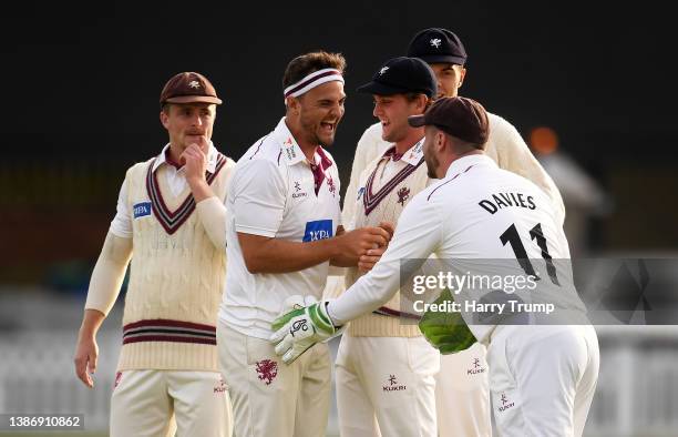 Jack Brooks of Somerset celebrates the wicket of Andrew Salter of Glamorgan with team mates Tom Abell, Tom Lammonby, Kasey Aldridge and Steve Davies...