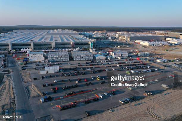 In this aerial view the new Tesla Gigafactory electric car manufacturing plant stands on March 21, 2022 near Gruenheide, Germany. The new plant,...