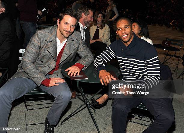 Actor Bradley Cooper and New York Giants wide receiver Victor Cruz attends Tommy Hilfiger Presents Fall 2012 Men's Collection show during...