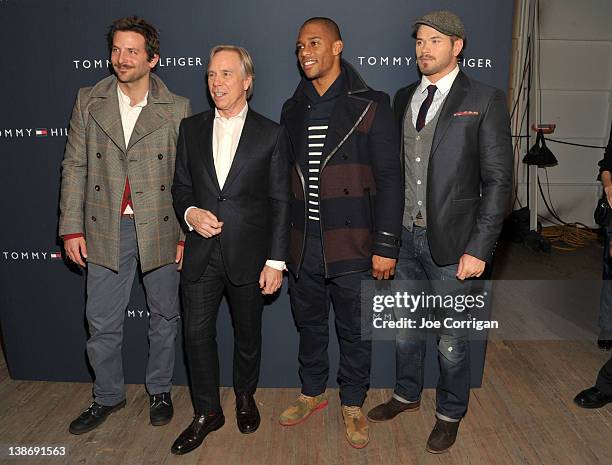 Bradley Cooper, designer Tommy Hilfiger, New York Giants wide receiver Victor Cruz, and Kellan Lutz pose backstage at the Tommy Hilfiger Men's Fall...