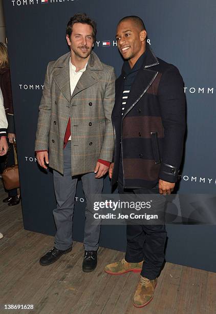 Actor Bradley Cooper and New York Giants wide receiver Victor Cruz pose backstage at the Tommy Hilfiger Presents Fall 2012 Men's Collection show...