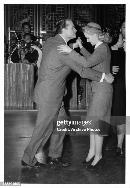 Red Skelton dances with Marilyn Maxwell in a scene from the film 'The Show-Off', 1946.