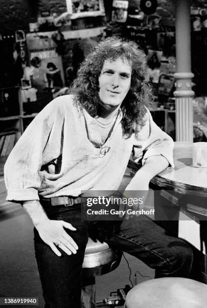 View of American Pop & Soul singer Michael Bolton , seated on a bar stool, during an interview on MTV at Teletronic Studios, New York, New York, June...