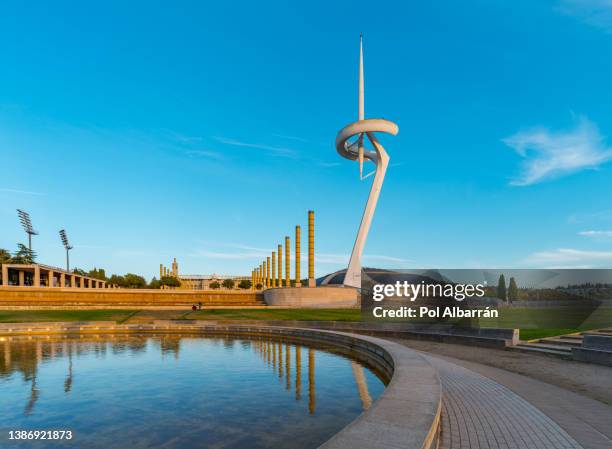 communications tower in the montjuic district of barcelona taken from the public montjuic city park during a sunny day. - montjuic 個照片及圖片檔