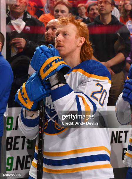 Cody Eakin of the Buffalo Sabres stands for playing of the national anthem before the game against the Edmonton Oilers on March 17, 2022 at Rogers...