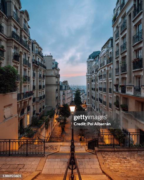 montmartre district of paris. morning montmartre staircase in paris, france. europa. view of cozy street in quarter montmartre in paris, france. - saint denis paris stock-fotos und bilder