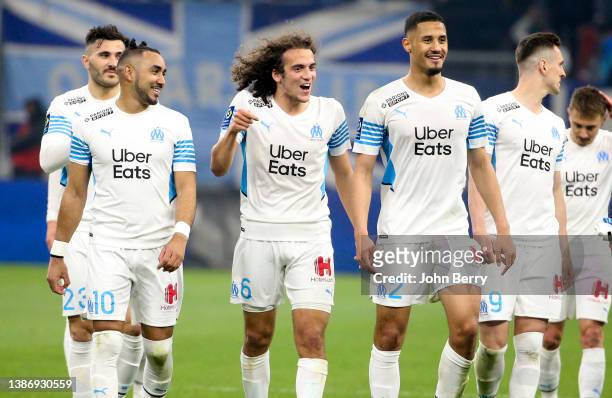 Dimitri Payet, Matteo Guendouzi, William Saliba, Arkadiusz Milik of Marseille celebrate the victory following the Ligue 1 Uber Eats match between...