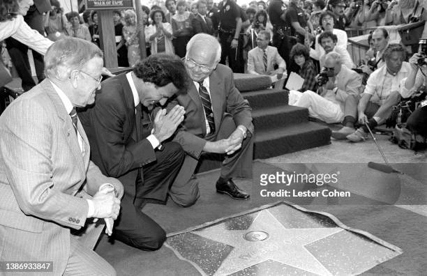 Spanish singer and songwriter, Julio Iglesias, receives his Hollywood Walk of Fame Star from American radio personality and television producer...