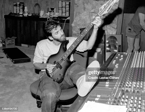 American musician, singer and songwriter, Kenny Loggins, sits in the recording studio circa 1985 in Los Angeles, California.