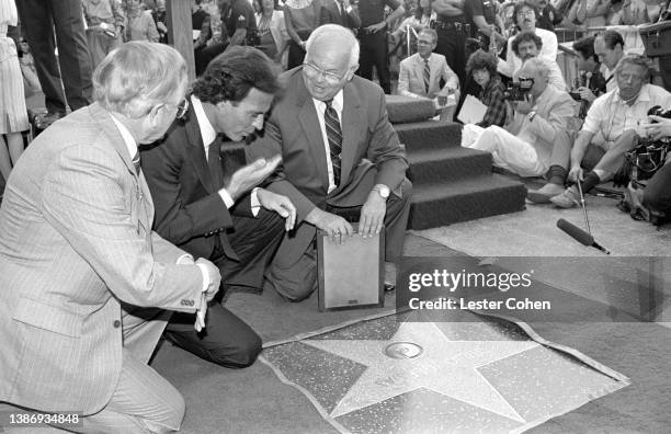 Spanish singer and songwriter, Julio Iglesias, receives his Hollywood Walk of Fame Star from American radio personality and television producer...