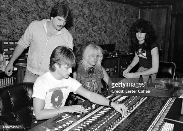 American musician Vince Neil and American musician Tommy Lee, of the American heavy metal band Mötley Crüe, sit in the recording studio with...