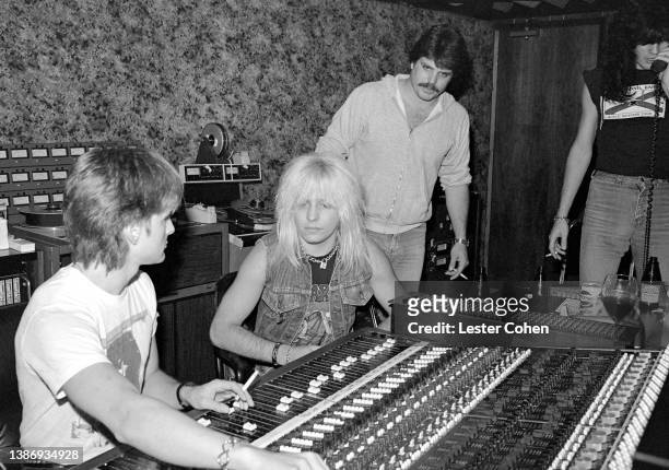 American musician Vince Neil and American musician Tommy Lee, of the American heavy metal band Mötley Crüe, sit in the recording studio with...