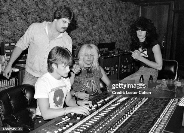 American musician Vince Neil and American musician Tommy Lee, of the American heavy metal band Mötley Crüe, sit in the recording studio with...