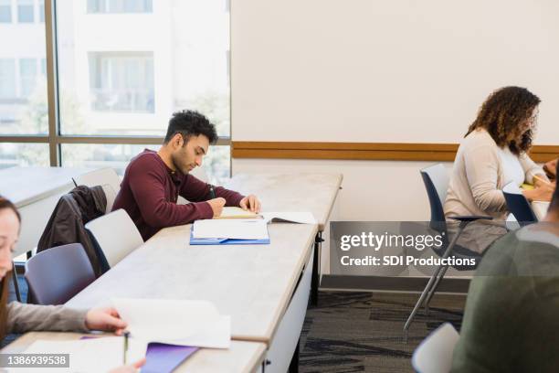 classmates work quietly - citizenship test stock pictures, royalty-free photos & images