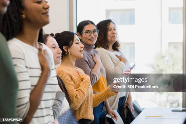 young women stand proudly - student visa stockfoto's en -beelden