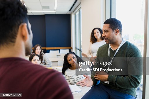 Tutor addresses the class Tutor addresses the class