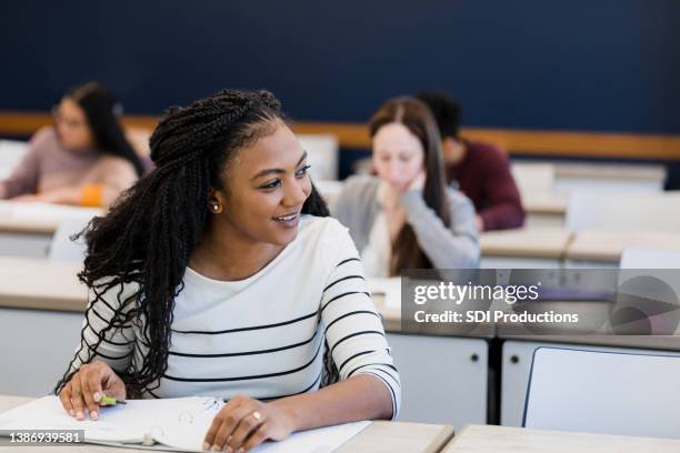 young woman talks with her peer - alumni bildbanksfoton och bilder