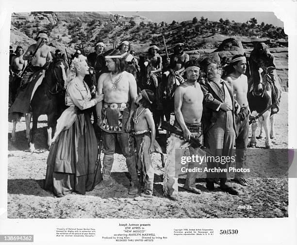 Marilyn Maxwell speaking with the natives in a scene from the film 'New Mexico', 1950.