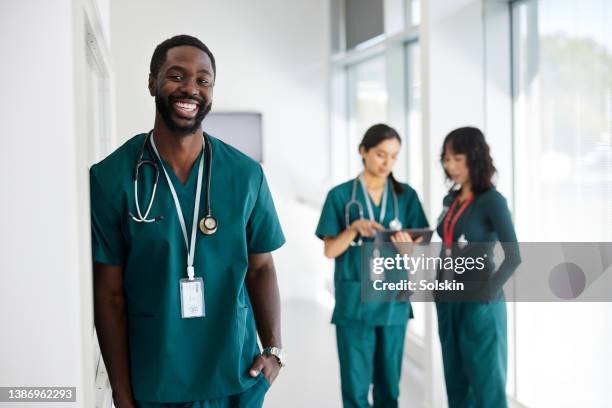 three medical professionals in hospital - operations manager stock pictures, royalty-free photos & images