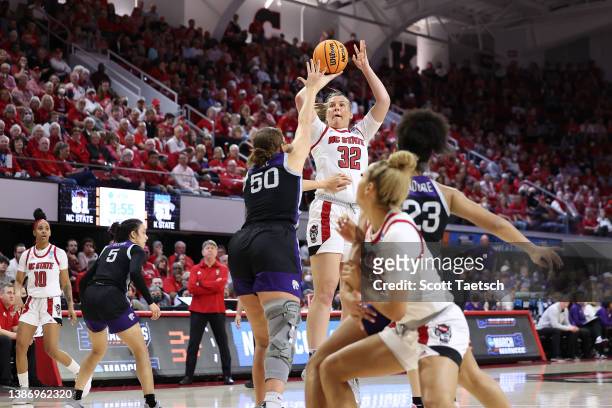 Sophie Hart of the NC State Wolfpack shoots over Ayoka Lee of the Kansas State Wildcats in a second round game of the 2022 NCAA Women's Basketball...