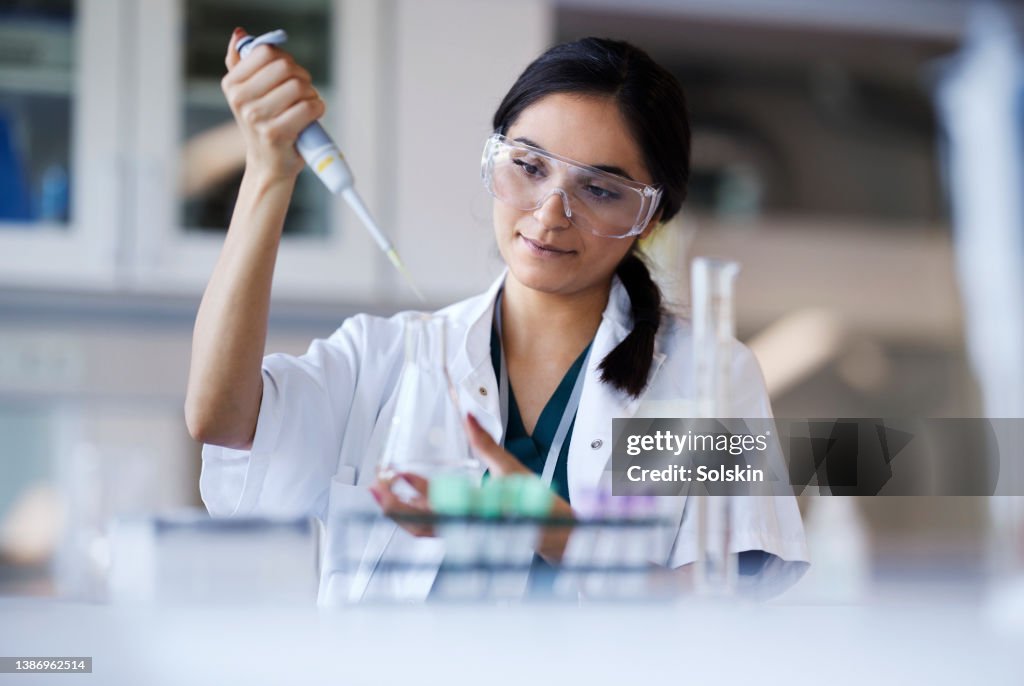 Young female scientist working in laboratory