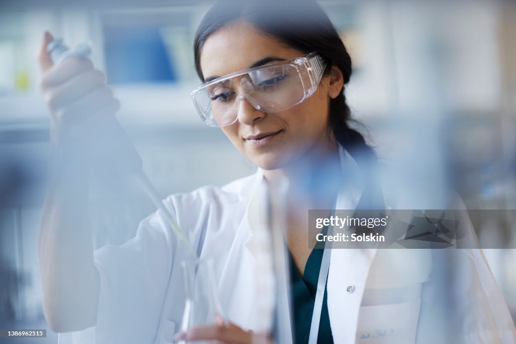 Young female scientist working in laboratory