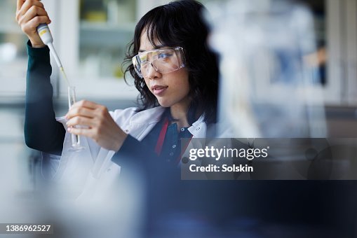 Young female scientist working in laboratory Young female scientist working in laboratory