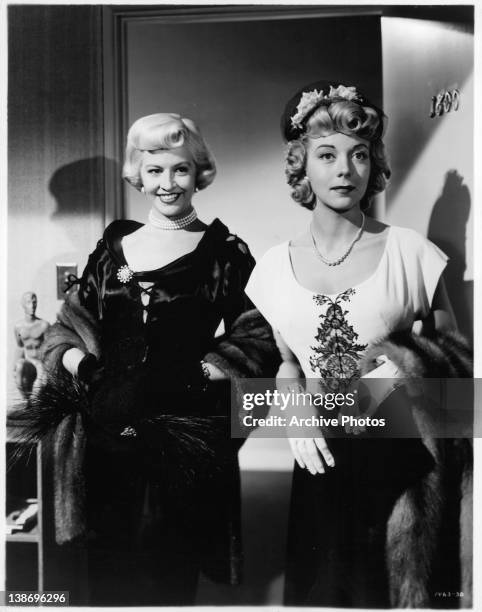 Marilyn Maxwell and unidentified woman standing in the doorway in a scene from the film 'Key To The City', 1950.